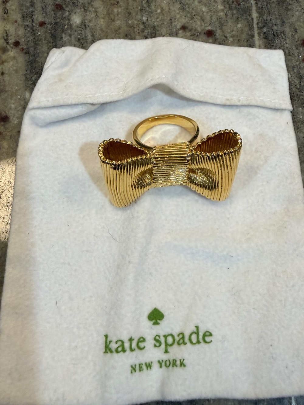 Kate Spade “all wrapped up” Bow gold cocktail ring size 7